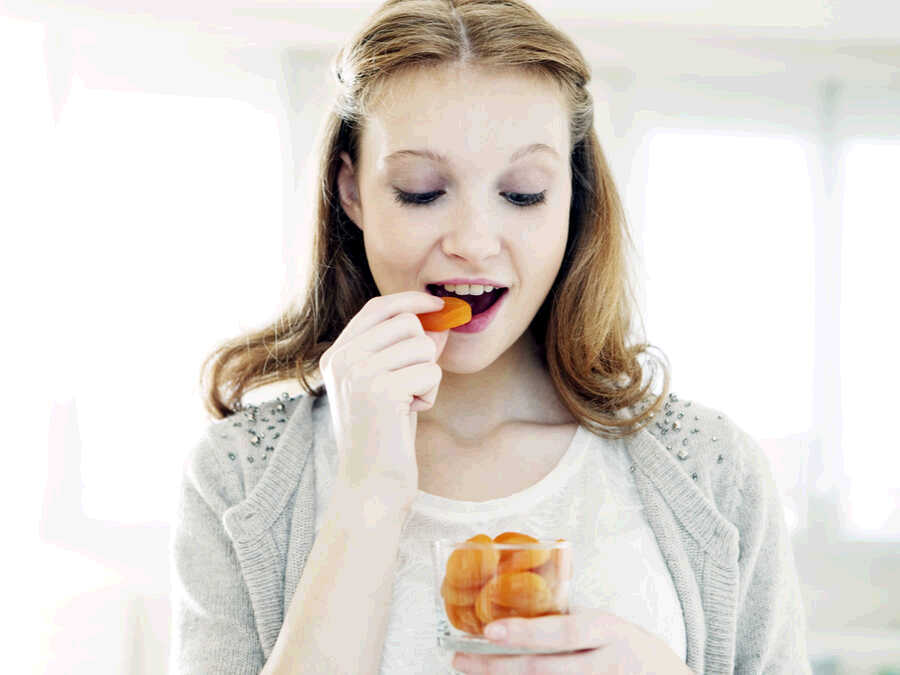 snacking on dried fruit